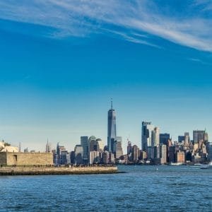 city skyline across body of water during daytime